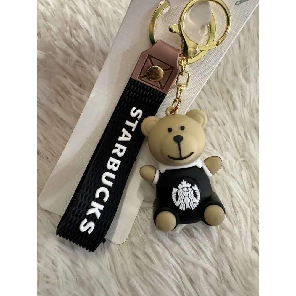 Starbucks bear black keychain with white sash and black Starbucks logo